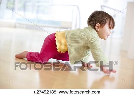 Stock Photography - Toddler crawling. Fotosearch