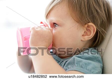 Toddler drinking View Large Photo Image Stock Image - Toddler drinking. Fotosearch