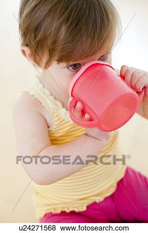 Toddler drinking View Large Photo Image Stock Photo - Toddler drinking. Fotosearch