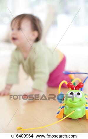 Toddler playing View Large Photo Image Picture - Toddler playing. Fotosearch