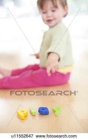 Toddler playing View Large Photo Image Stock Photo - Toddler playing. Fotosearch