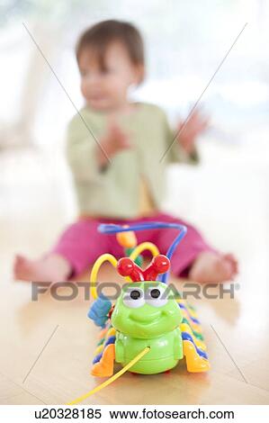 Toddler playing View Large Photo Image Stock Photography - Toddler playing. Fotosearch