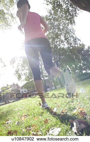 Woman jogging View Large Photo Image Stock Image - Woman jogging. Fotosearch