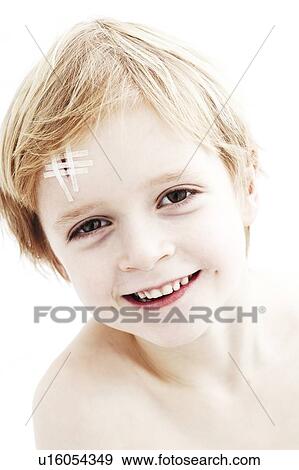 Young boy with head wound View Large Photo Image Stock Photo - Young boy with head wound. Fotosearch