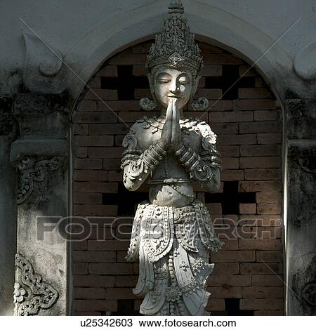 Stock Image - Apsara statue at Mandarin Oriental Dhara Dhevi, Chiang Mai, Thailand. Fotosearch