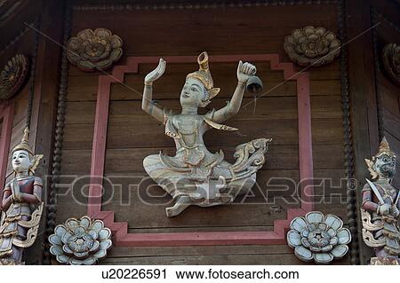 Stock Image - Apsara statues at the entrance of Mandarin Oriental Dhara Dhevi, Chiang Mai, Thailand. Fotosearch