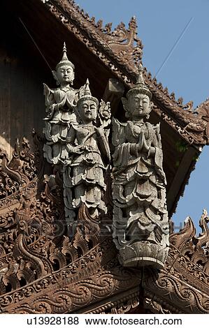 Stock Photo - Apsara statues on the top of Mandarin Oriental Dhara Dhevi, Chiang Mai, Thailand. Fotosearch