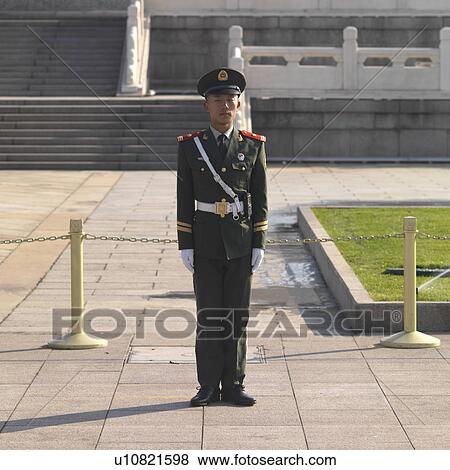 Stock Photo - Army soldier standing at the Monument To The People's Heroes, Tiananmen Square, Beijing, China. Fotosearch