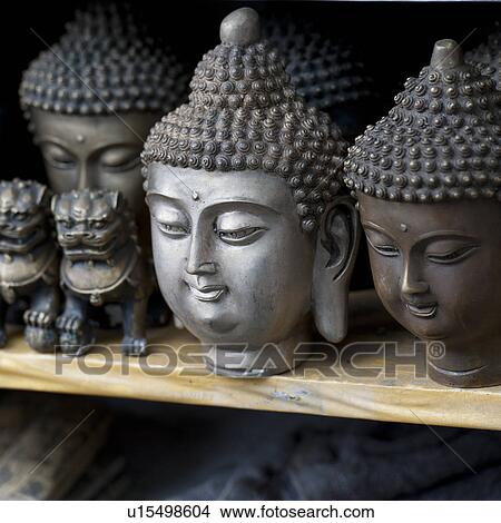 Artifacts for display at a market stall, Shanghai, China View Large Photo Image Picture - Artifacts for display at a market stall, Shanghai, China. Fotosearch