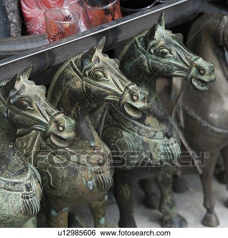 Stock Photograph - Artifacts for display at a market stall, Shanghai, China. Fotosearch