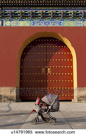 Stock Photography - Baby carriage in front of a gate at the Temple Of Heaven, Beijing, China. Fotosearch