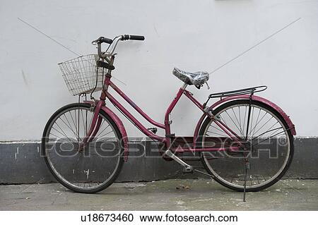 Bicycle near a wall, Shanghai, China View Large Photo Image Stock Image - Bicycle near a wall, Shanghai, China. Fotosearch