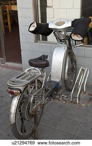 Stock Photo - Bicycle parked in front of a house, Beijing, China. Fotosearch
