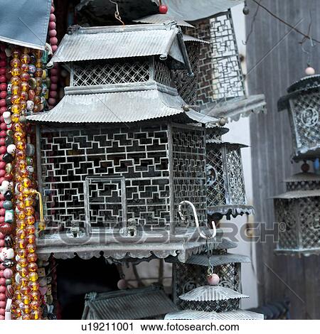 Stock Image - Birdcages at a street market, Shanghai, China. Fotosearch