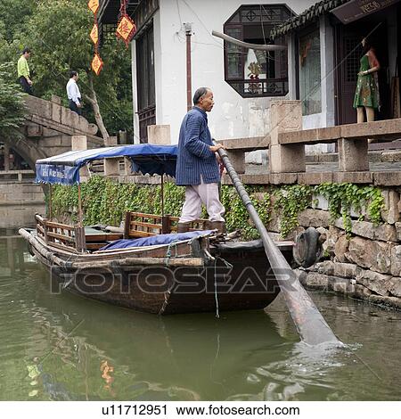 Boat in a canal, Zhouzhuang, Jiangsu Province, China View Large Photo Image Stock Image - Boat in a canal, Zhouzhuang, Jiangsu Province, China. Fotosearch