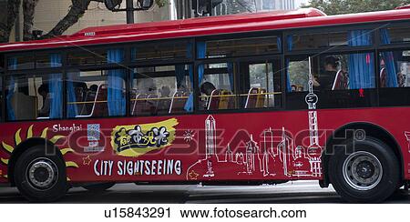 Stock Image - Bus on the road, Shanghai, China. Fotosearch