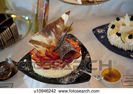 Stock Image - Cake garnish with strawberry in cruise ship Silver Shadow, East China Sea. Fotosearch