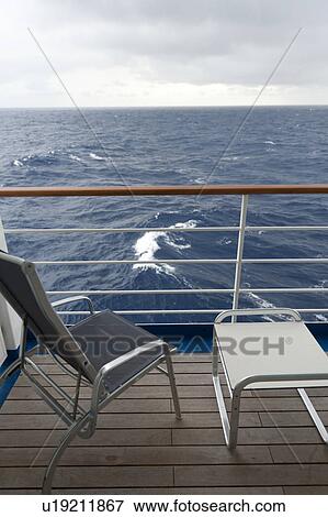 Chair and a stool on the deck of cruise ship Silver Shadow, East China Sea View Large Photo Image Stock Photo - Chair and a stool on the deck of cruise ship Silver Shadow, East China Sea. Fotosearch