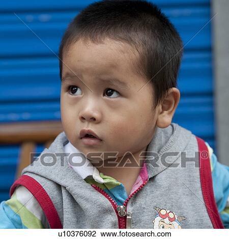 Close-up of a boy, Shanghai, China View Large Photo Image Stock Image - Close-up of a boy, Shanghai, China. Fotosearch