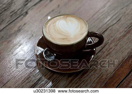 Stock Photo - Close-up of a cup of cappuccino, Thailand. Fotosearch