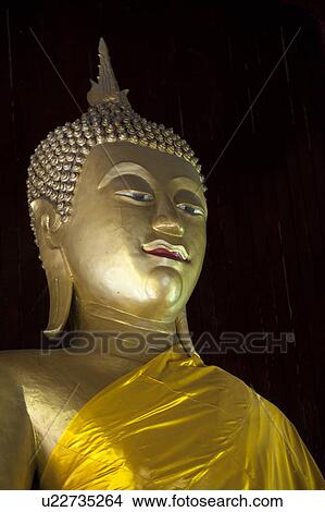 Picture - Close-up of a statue of Buddha at Wat Horcome, Chiang Mai, Thailand. Fotosearch