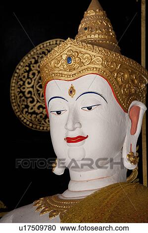 Stock Image - Close-up of a statue of Buddha in Wat Chedi Luang, Chiang Mai, Thailand. Fotosearch