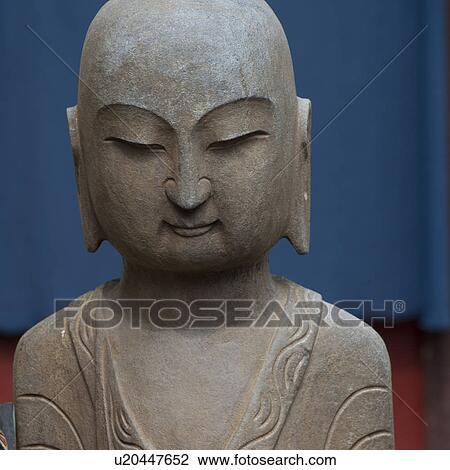 Stock Image - Close-up of a statue of Buddha, Shanghai, China. Fotosearch