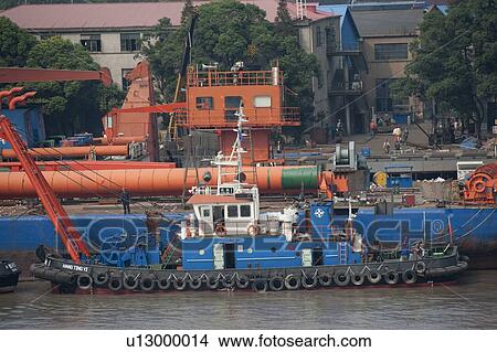 Container ship at a commercial dock, Yangtze River, Shanghai, China View Large Photo Image Picture - Container ship at a commercial dock, Yangtze River, Shanghai, China. Fotosearch