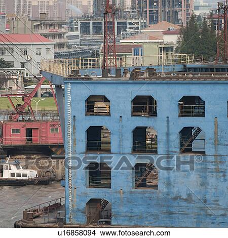 Container ship at a commercial dock, Yangtze River, Shanghai, China View Large Photo Image Picture - Container ship at a commercial dock, Yangtze River, Shanghai, China. Fotosearch