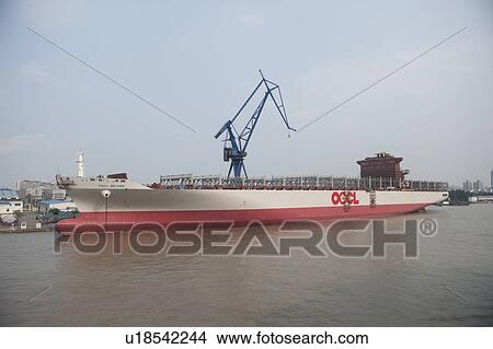 Picture - Container ship at a commercial dock, Yangtze River, Shanghai, China. Fotosearch