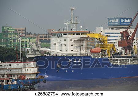 Container ship at a commercial dock, Yangtze River, Shanghai, China View Large Photo Image Picture - Container ship at a commercial dock, Yangtze River, Shanghai, China. Fotosearch