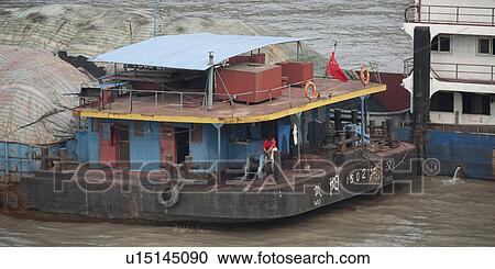 Stock Image - Container ship at a commercial dock, Yangtze River, Shanghai, China. Fotosearch