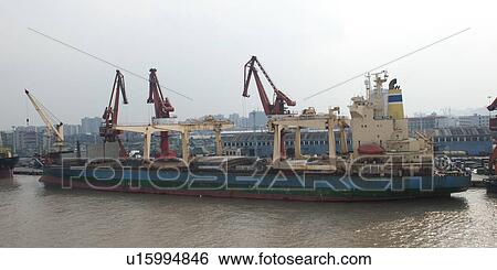 Container ship at a commercial dock, Yangtze River, Shanghai, China View Large Photo Image Stock Photograph - Container ship at a commercial dock, Yangtze River, Shanghai, China. Fotosearch