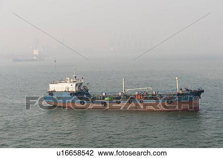 Stock Image - Container ship in the East China Sea, Tianjin, China. Fotosearch