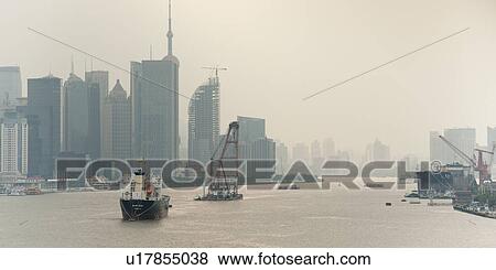 Stock Photo - Container ship in the Huangpu River, Pudong, Shanghai, China. Fotosearch