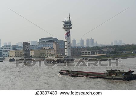 Stock Image - Container ship in the Yangtze River, Shanghai, China. Fotosearch