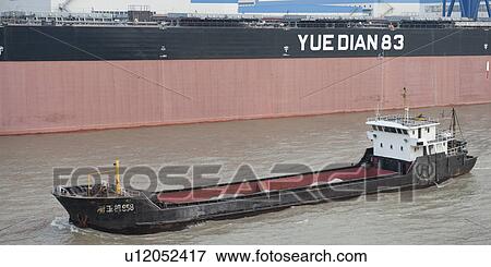 Container ship in the Yangtze River, Shanghai, China View Large Photo Image Stock Photo - Container ship in the Yangtze River, Shanghai, China. Fotosearch