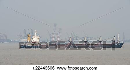 Stock Photograph - Container ship in the Yangtze River, Shanghai, China. Fotosearch