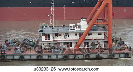 Stock Photograph - Container ship in the Yangtze River, Shanghai, China. Fotosearch