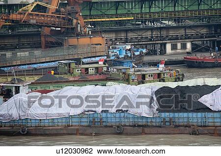 Stock Image - Container ships at a commercial dock, Yangtze River, Shanghai, China. Fotosearch