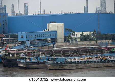 Container ships at a commercial dock, Yangtze River, Shanghai, China View Large Photo Image Stock Image - Container ships at a commercial dock, Yangtze River, Shanghai, China. Fotosearch
