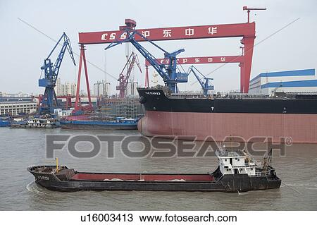 Container ships at a commercial dock, Yangtze River, Shanghai, China View Large Photo Image Stock Image - Container ships at a commercial dock, Yangtze River, Shanghai, China. Fotosearch