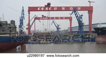 Container ships at a commercial dock, Yangtze River, Shanghai, China View Large Photo Image Stock Photo - Container ships at a commercial dock, Yangtze River, Shanghai, China. Fotosearch