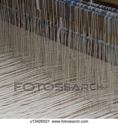 Cotton weaving in a loom, Chiang Mai, Thailand View Large Photo Image Stock Photo - Cotton weaving in a loom, Chiang Mai, Thailand. Fotosearch