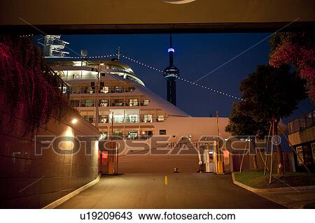 Cruise ship at a commercial dock with the Oriental Pearl Tower in the background, Shanghai, China View Large Photo Image Stock Image - Cruise ship at a commercial dock with the Oriental Pearl Tower in the background, Shanghai, China. Fotosearch