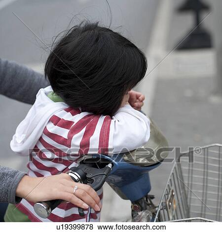 Family riding a scooter, Shanghai, China View Large Photo Image Stock Photo - Family riding a scooter, Shanghai, China. Fotosearch
