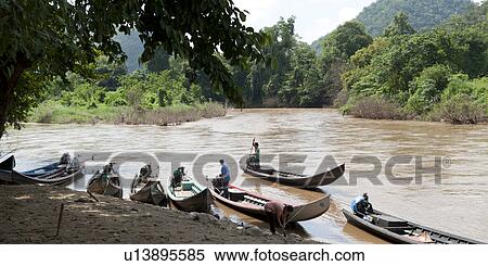 Fishermen with boats in the river, Thailand View Large Photo Image Stock Photography - Fishermen with boats in the river, Thailand. Fotosearch