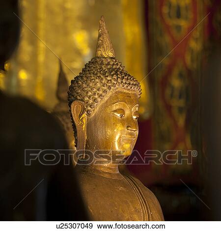 Stock Photo - Golden statue of Buddha at Wat Phra Singh, Chiang Mai, Thailand. Fotosearch
