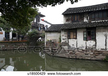 Stock Photo - Houses along a canal, Zhouzhuang, Jiangsu Province, China. Fotosearch