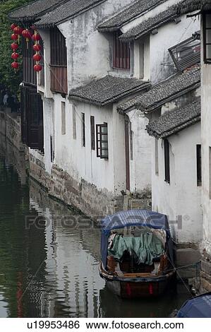Stock Photograph - Houses along a canal, Zhouzhuang, Jiangsu Province, China. Fotosearch
